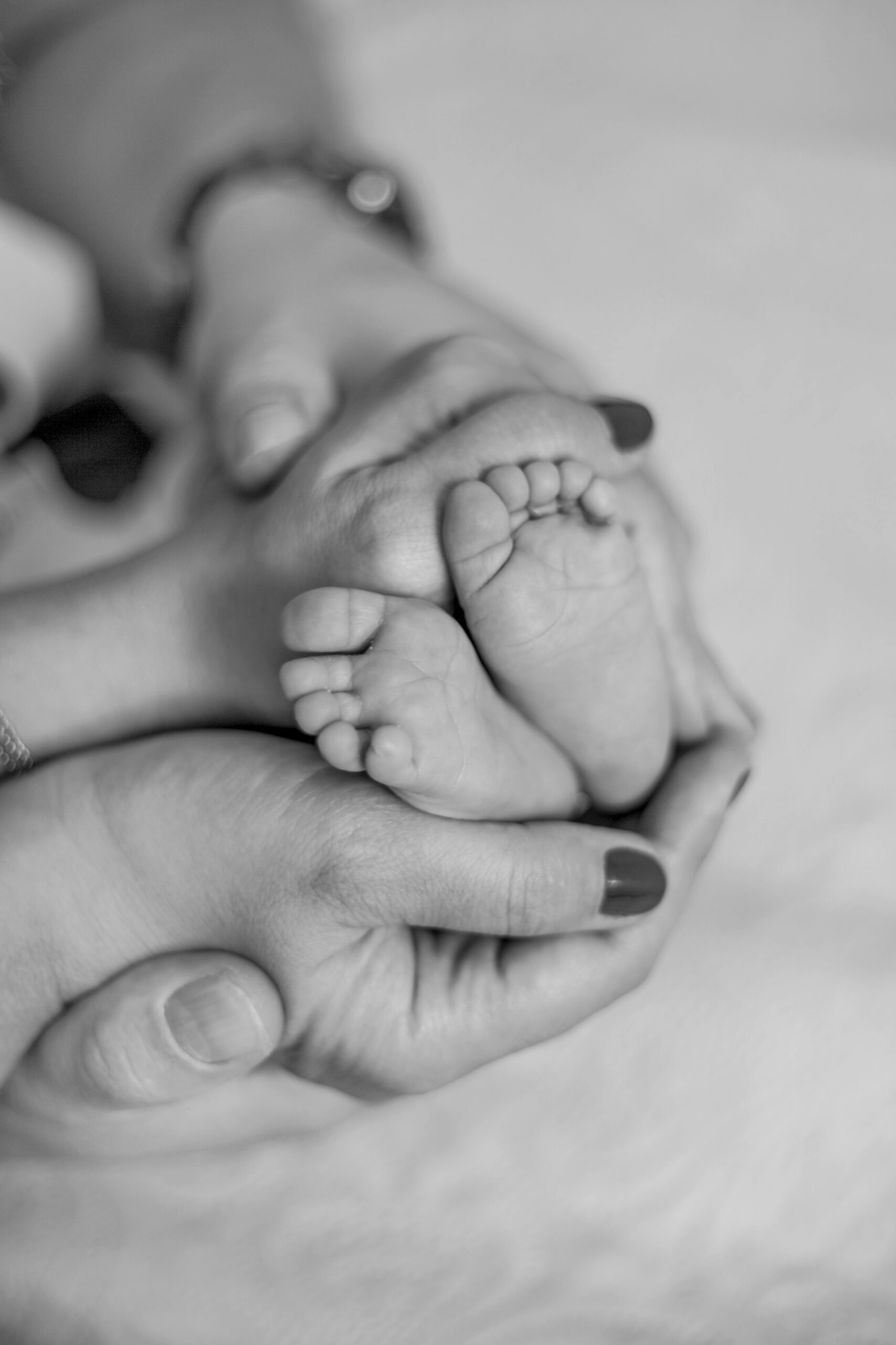 Baby feet in hands