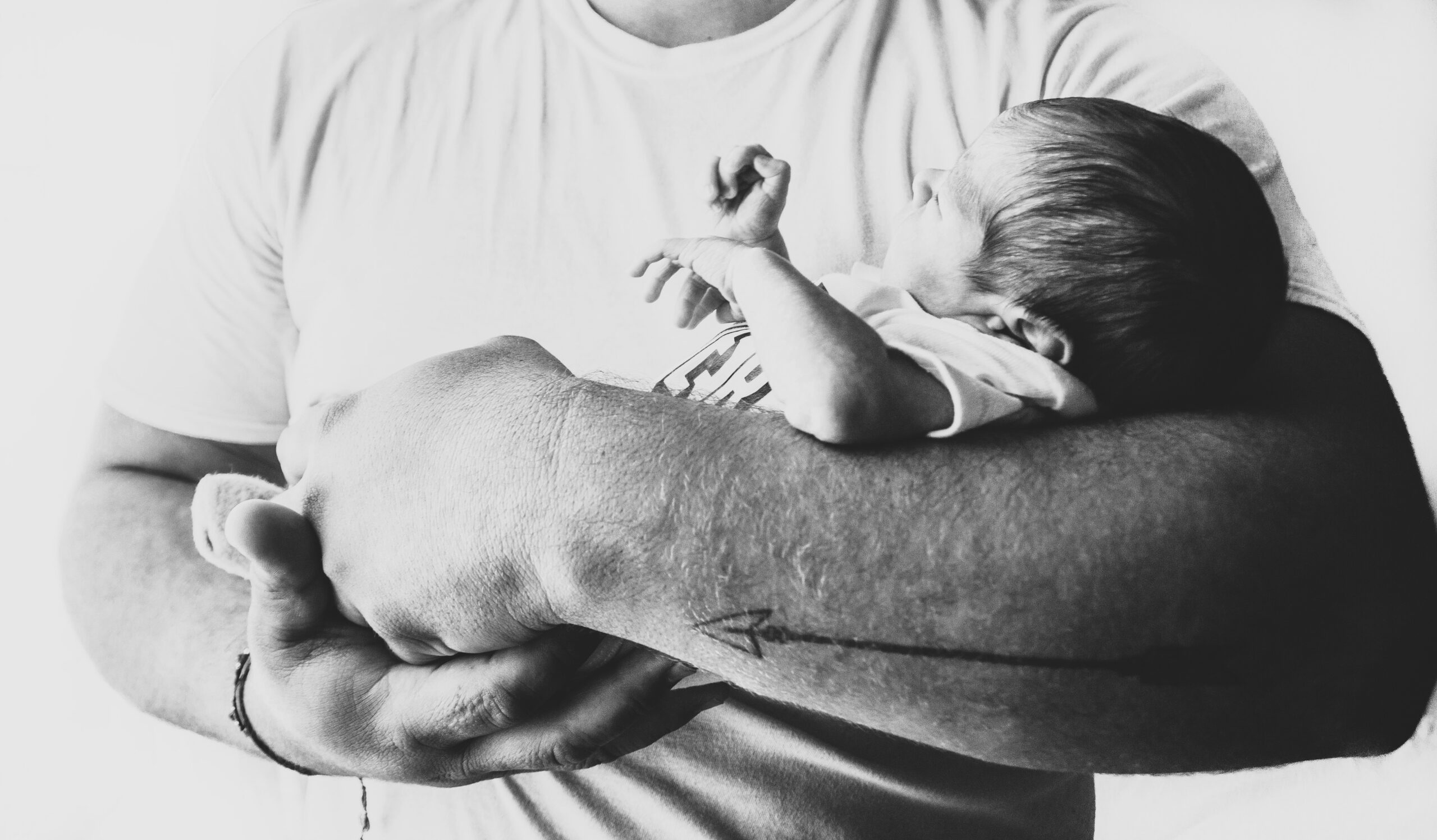 Photo of a man holding a baby